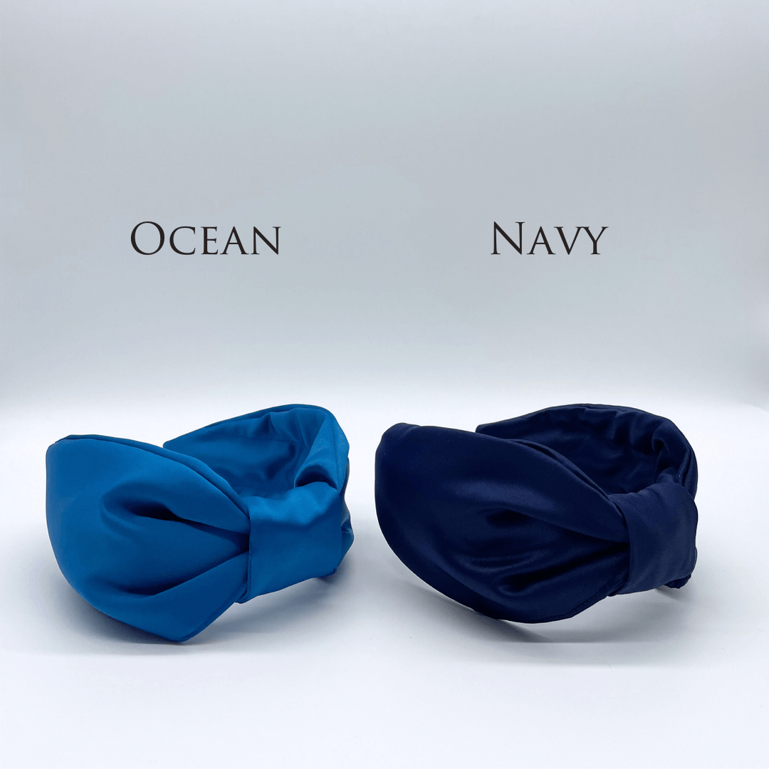 Two satin knot headbands in blue and navy.