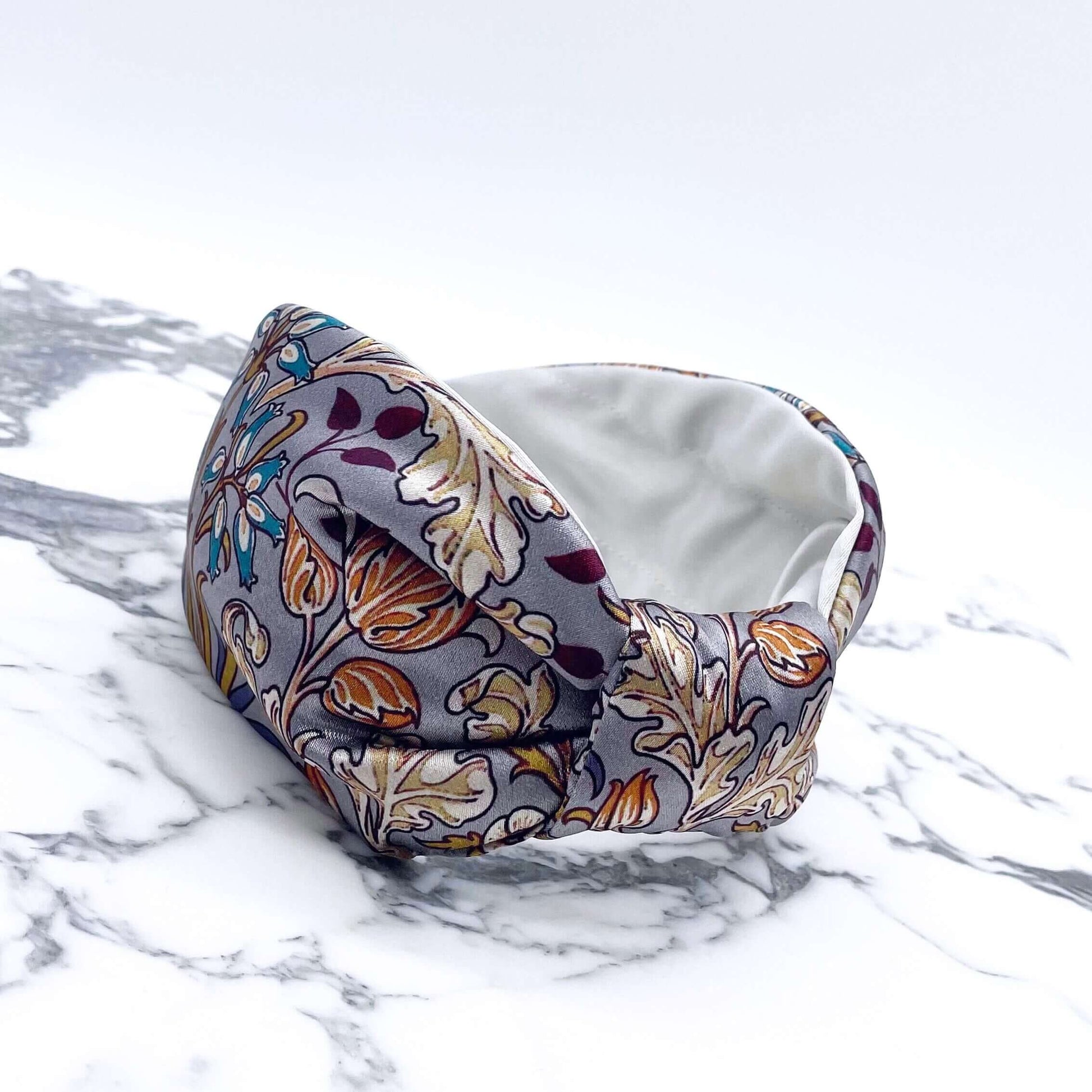 A beautiful grey, William Morris-inspired, patterned knot headband.