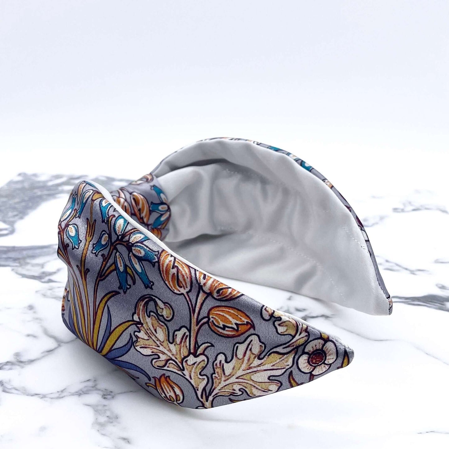 A beautiful grey, William Morris-inspired, patterned knot headband.