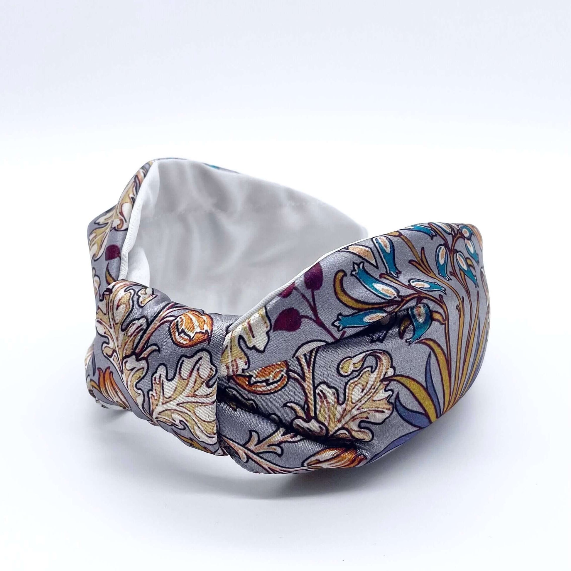 A beautiful grey, William Morris-inspired, patterned knot headband.