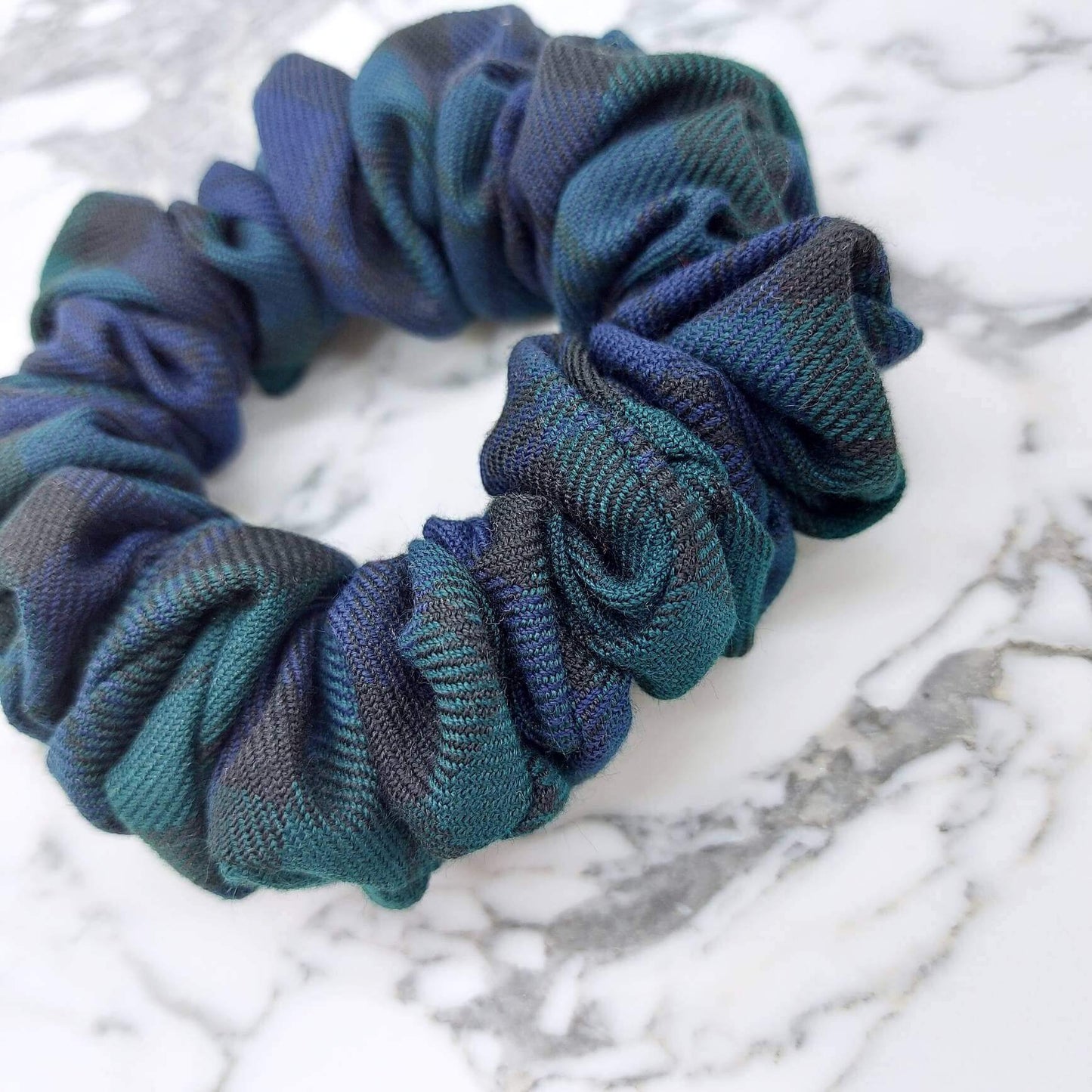 A luxury tartan check, green and navy hair scrunchie.