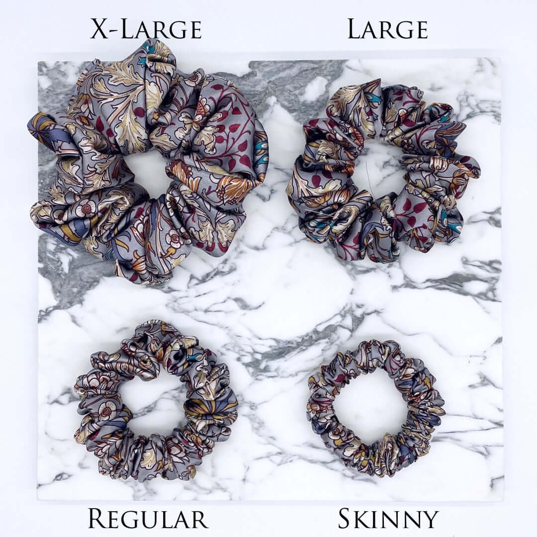 Four patterned satin scrunchies in different sizes