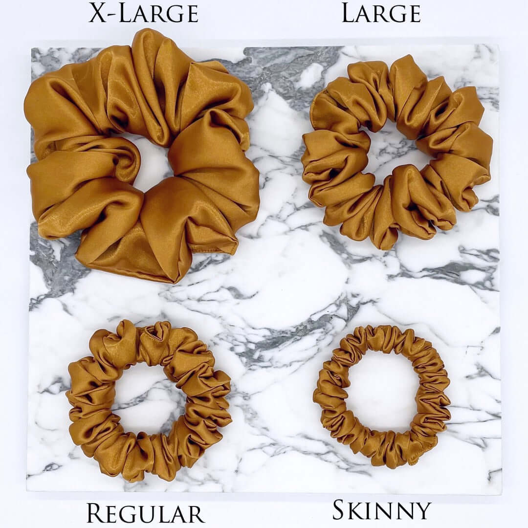 Four gold satin scrunchies in different sizes