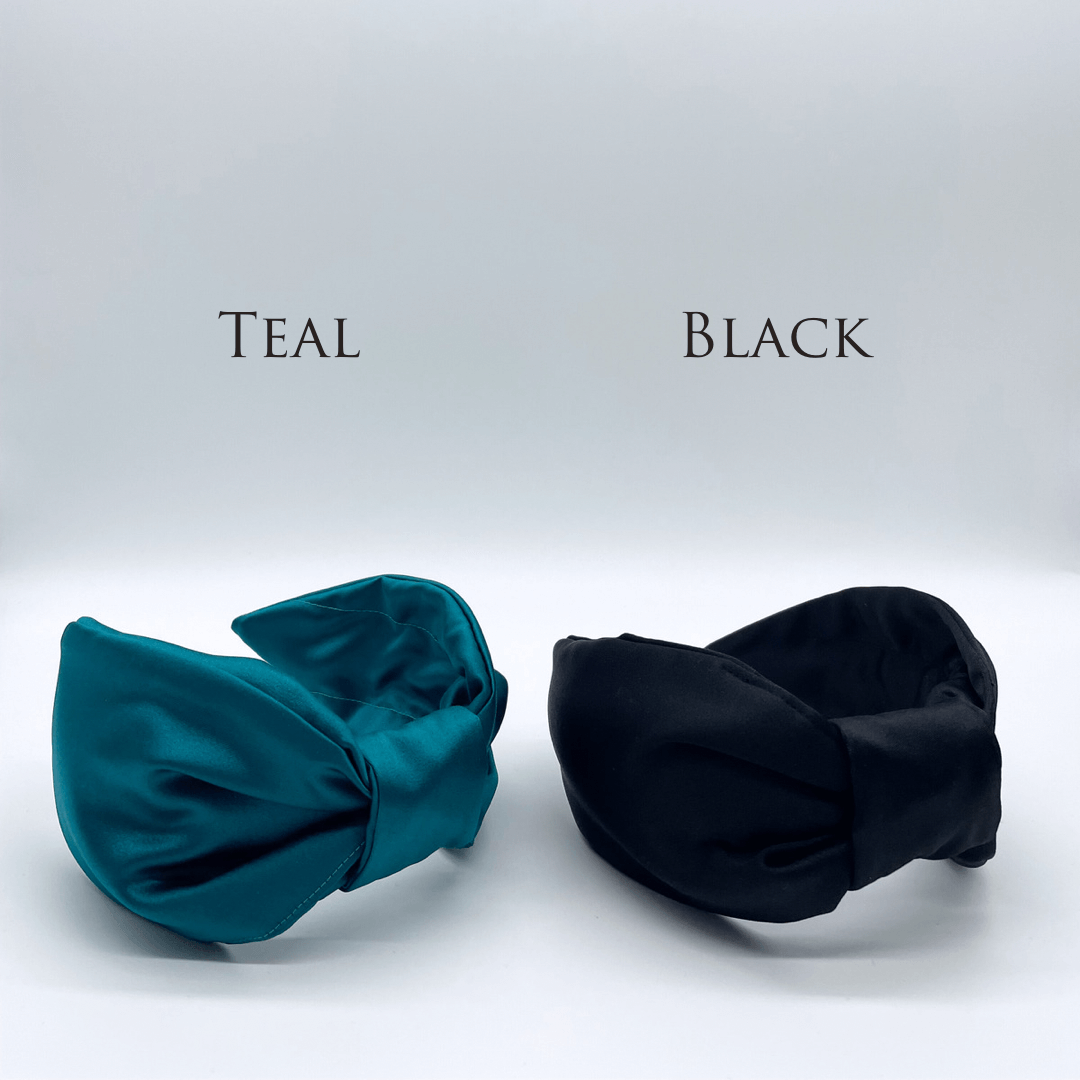 Two satin knot headbands in teal and black.