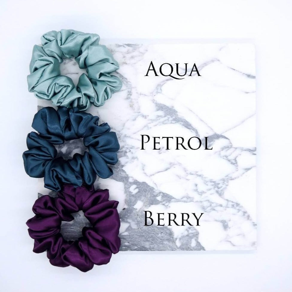 Three luxury large satin hair scrunchies in aqua blue, petrol and berry.