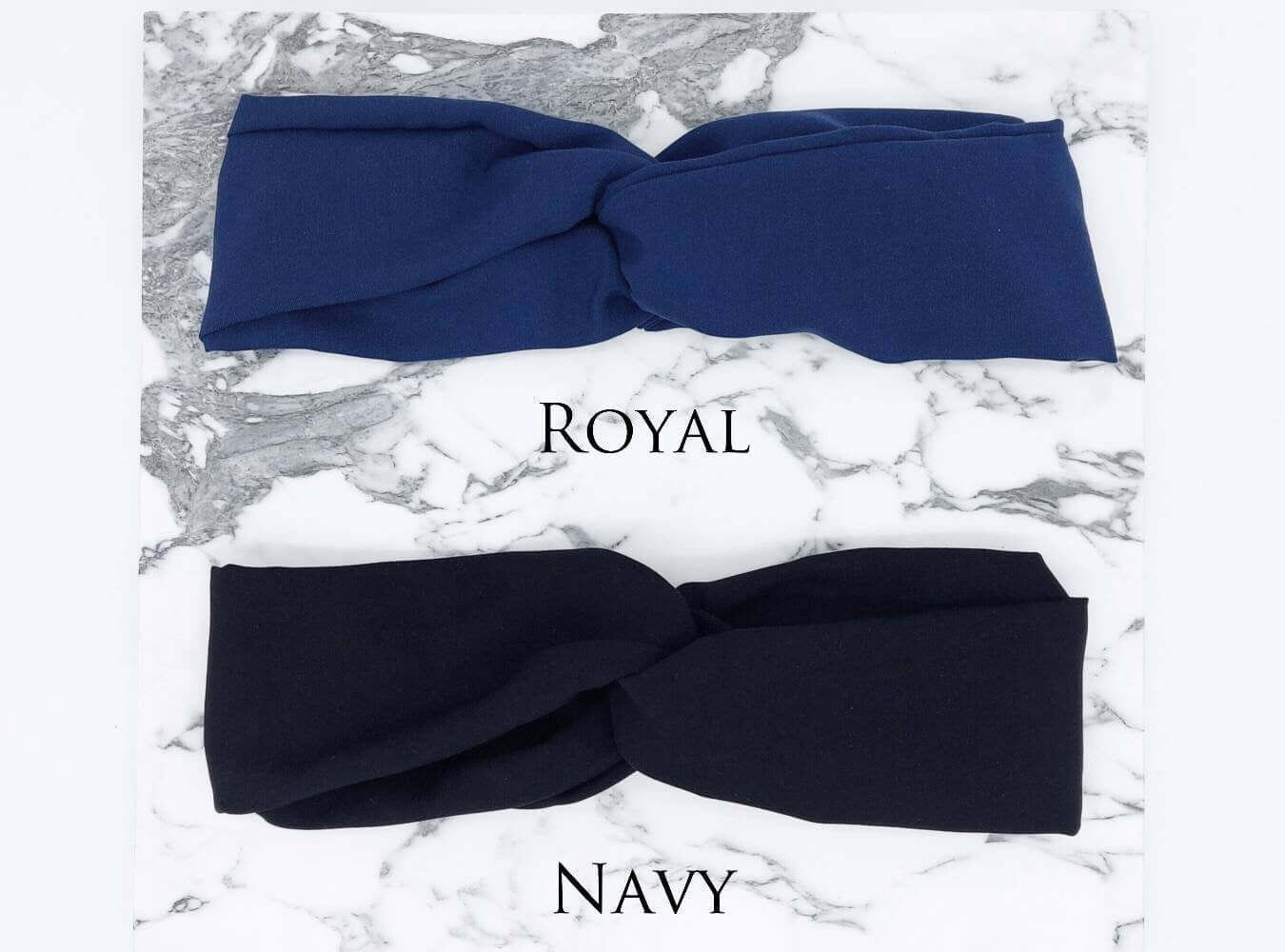 Two soft, viscose, elasticated turban twist headbands in royal blue and navy blue.