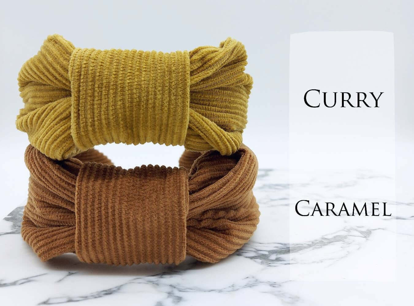 Two, luxury bow-style, corduroy fabric knot headbands in mustard and light brown.